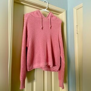 Pink sweater in size medium. Lightly worn.